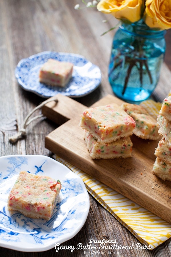 These bars are so gooey and perfect...the sprinkles are a must! Funfetti Gooey Butter Shortbread Bars from thelittlekiitchen.com