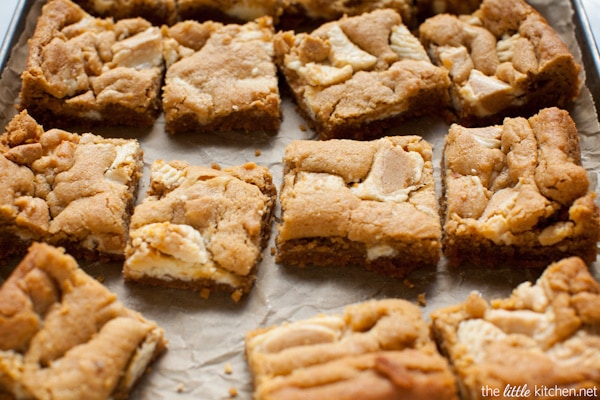 These bars are so easy to make...the crust is made with graham cracker crumbs & I used white chocolate Reese's butter cups! Peanut Butter Cookie Pie Bars from thelittlekiitchen.com