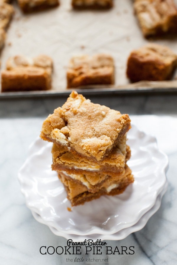 These bars are so easy to make...the crust is made with graham cracker crumbs & I used white chocolate Reese's butter cups! Peanut Butter Cookie Pie Bars from thelittlekiitchen.com