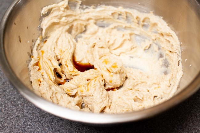 Mixing vanilla extract into Matcha Cookie batter from thelittlekiitchen.com