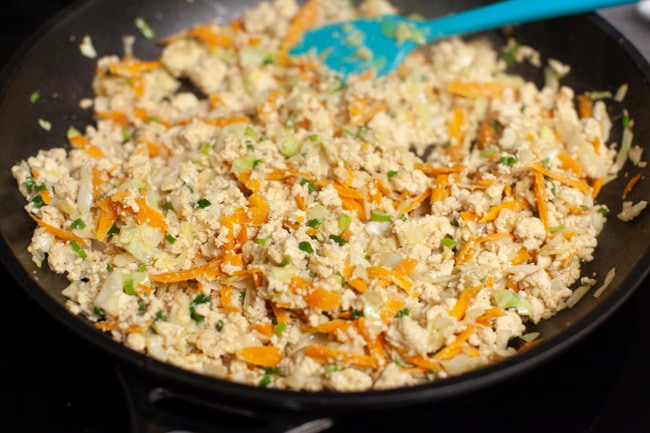 Skillet with Vegetarian Dumpling filling and blue spatula from thelittlekiitchen.com