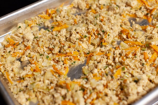 Vegetarian Dumpling filling spread in a thin layer on a baking sheet from thelittlekiitchen.com