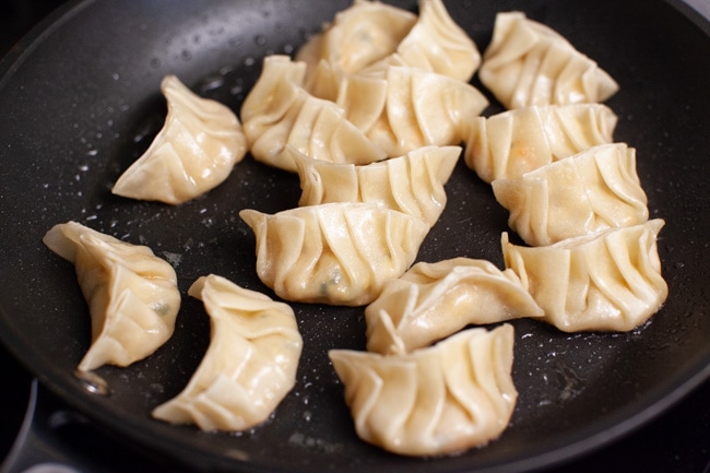 Cooked Vegetarian Dumplings in skillet from thelittlekiitchen.com